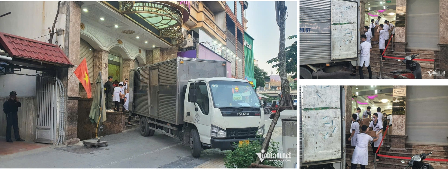 Nhân viên hỗ trợ lực lượng chức năng đưa tài liệu ra