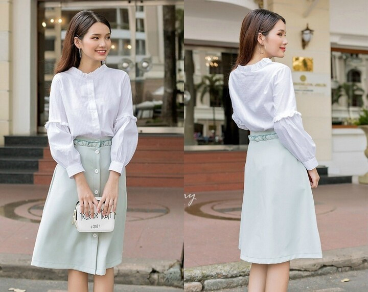 Chân váy midi có độ dài qua gối giúp che đi phần chân cong một cách tinh tế. (Ảnh: Pinterest)