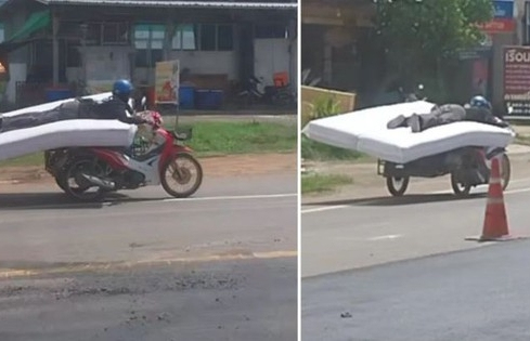 Thót tim cảnh người đàn ông lái xe máy trong khi nằm trên nệm