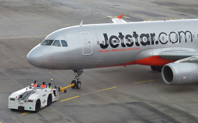 Jetstar Asia Airbus 320 being pushed back for departure at Changi Airport.jpg
