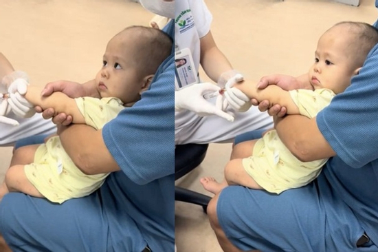 Em bé dũng cảm 'lườm' bác sĩ khi lấy máu khiến dân mạng cười bò