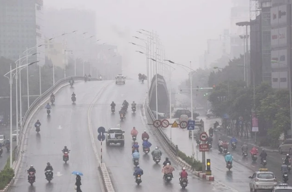 Miền Bắc đón đợt không khí lạnh mới, trời mưa phùn kèm sương mù dày đặc  - Ảnh 1.