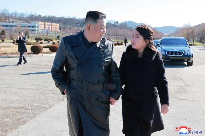 North Korean leader Kim Jong Un and his daughter attend a photo session with the scientists, engineers, military officials and others involved in the test-fire of the country's new Hwasong-17 intercontinental ballistic missile (ICBM) in this undated photo released on November 27, 2022 by North Korea's Korean Central News Agency (KCNA)