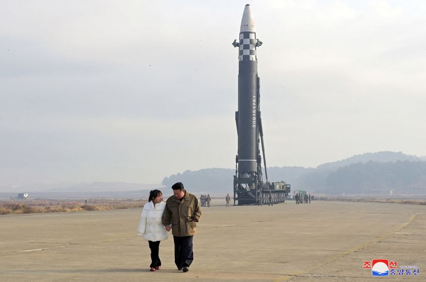 North Korean leader Kim Jong Un, along with his daughter, walks away from an intercontinental ballistic missile (ICBM) in this undated photo released on November 19, 2022 by North Korea's Korean Central News Agency (KCNA). KCNA via REUTERS ATTENTION EDITORS - THIS IMAGE WAS PROVIDED BY A THIRD PARTY. NO THIRD PARTY SALES. SOUTH KOREA OUT. NO COMMERCIAL OR EDITORIAL SALES IN SOUTH KOREA. REUTERS IS UNABLE TO INDEPENDENTLY VERIFY THIS IMAGE.