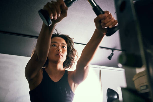 a woman in her 40s working out at a training gym 1774951261766227396503