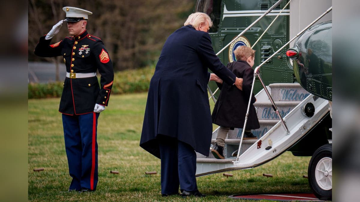 President Donald Trump lifts Elon Musk's son,
