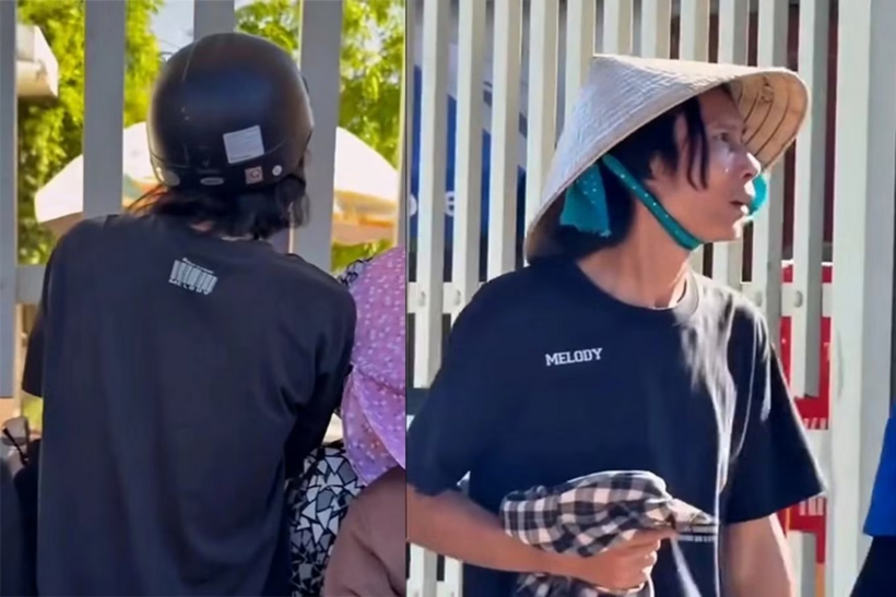 Hình ảnh người bố cầm áo khoác đứng ngóng con giữa nắng nóng sau giờ thi lớp 10 ở Nghệ An. Ảnh: Tiền phong