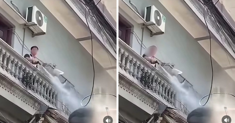 Công an vào cuộc vụ người đàn ông liên tục xịt nước vào thợ tháo dỡ công trình gây bức xúc插图 Hình ảnh người đàn ông liên tục xịt nước vào thợ tháo dỡ công trình gây bức xúc dư luận. (Ảnh: Cắt clip)